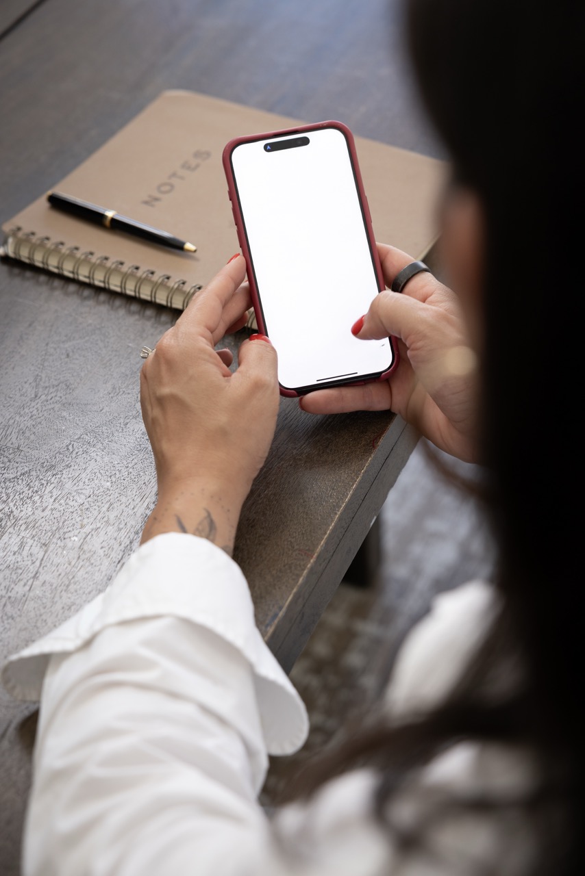 A person reviewing brand visuals on their phone